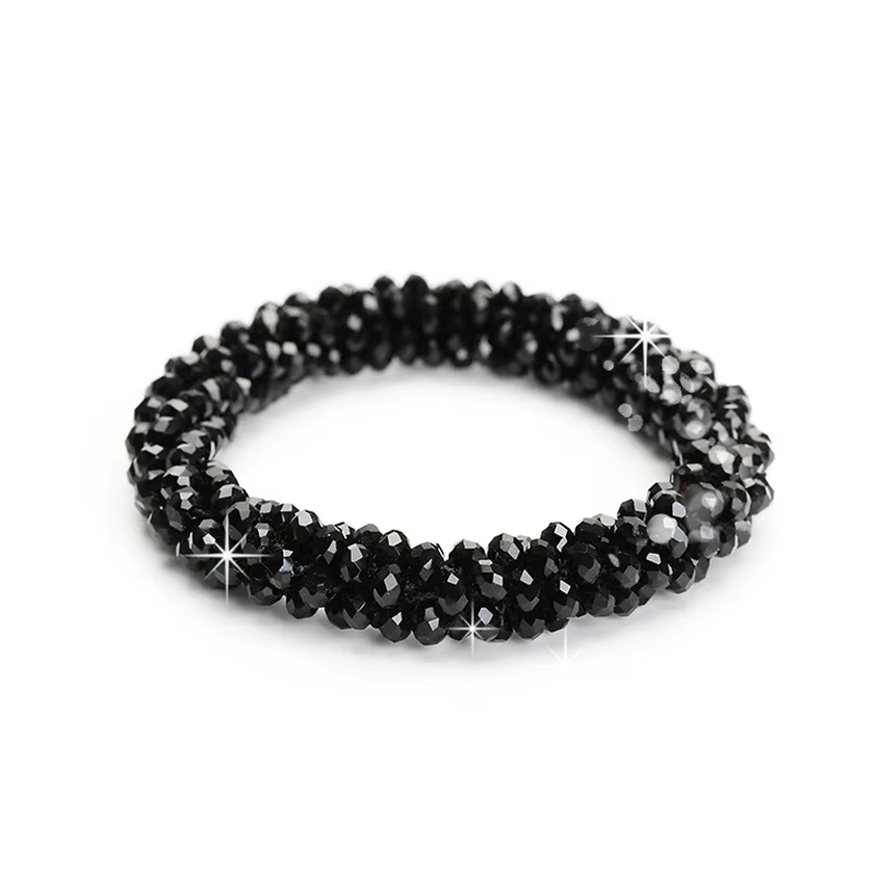 Black JuulC elastic and stretchy Bun Tie with sparkling imitation diamond stones, to create a dressage show bun for the rider